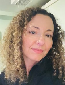 A headshot of Tanya, who is smiling